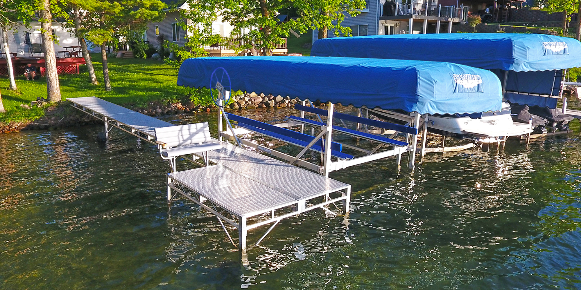 ShoreMaster Infinity TS9 with Gray Glacier Decking and Vertical Lift with Blue Canopy Cover