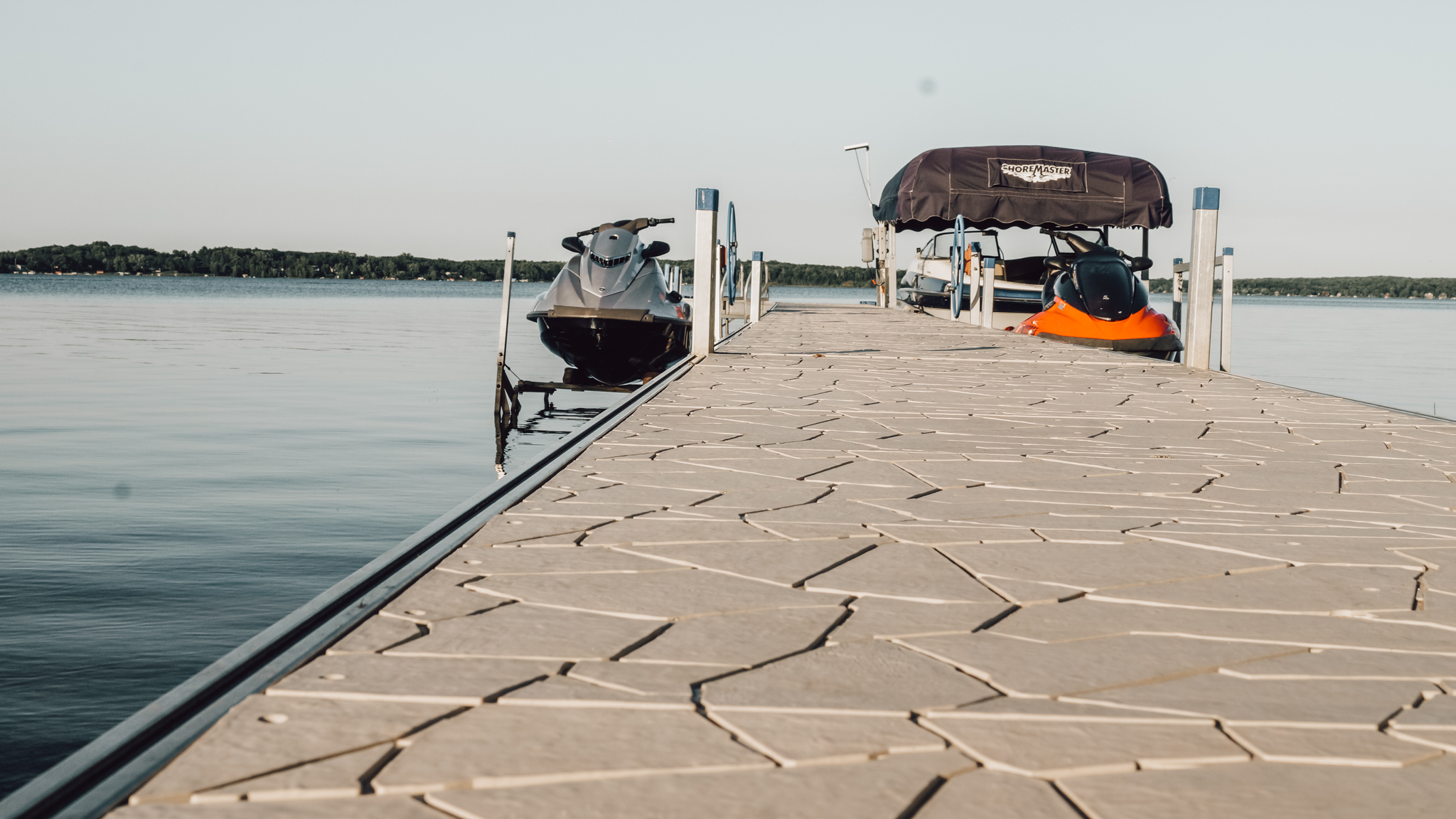 Boat is docked at the end of a pier